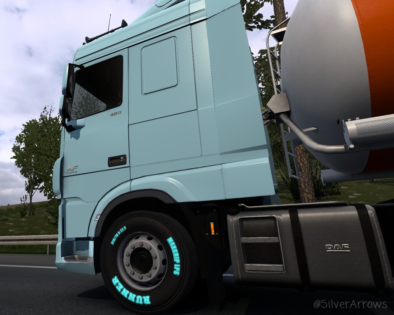 Powder blue DAF XF with cyan branding on the tyres